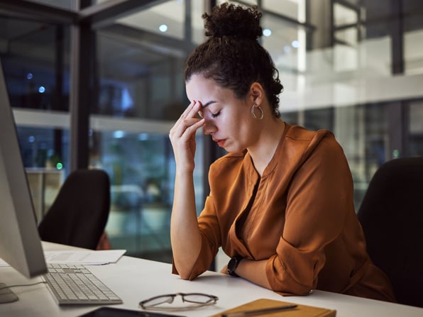 female attorney experiencing employee burnout at desk