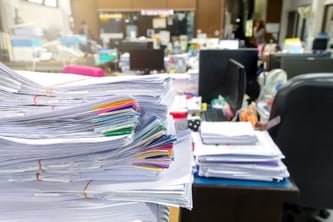 stacks of paper in office 