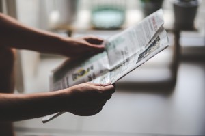 Man Holding Newspaper 