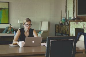 woman working at home computer